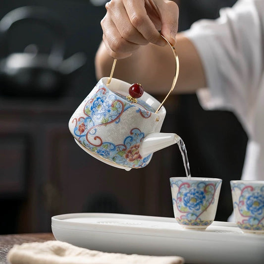 Delicate teapot and teacups